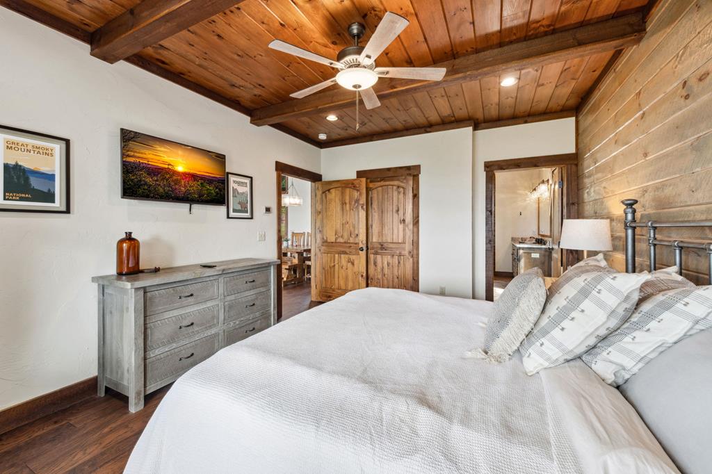 370 High Ridge Road Epworth, GA 30541 - Photo 27 of 61 a bedroom with a bed and a flat screen tv