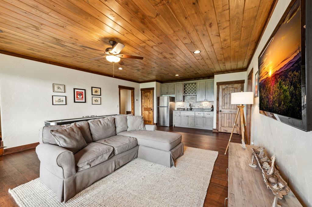 370 High Ridge Road Epworth, GA 30541 - Photo 45 of 61 a living room with furniture and a flat screen tv