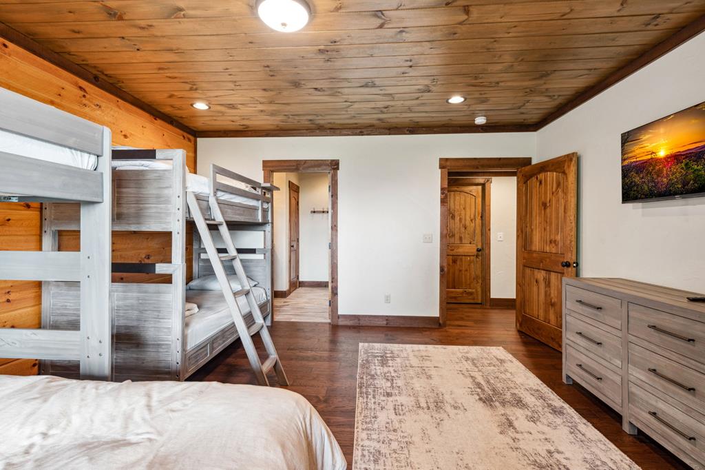 370 High Ridge Road Epworth, GA 30541 - Photo 57 of 61 a bedroom with furniture and flat screen tv