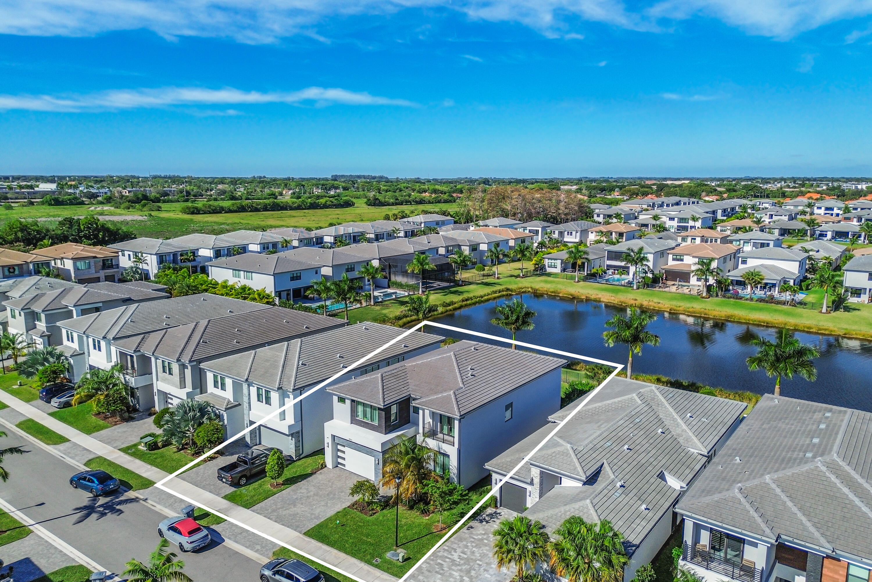 8593 Swinley Frst Way Boca Raton, FL 33434 - Photo 19 of 35 an aerial view of residential houses with outdoor space and river