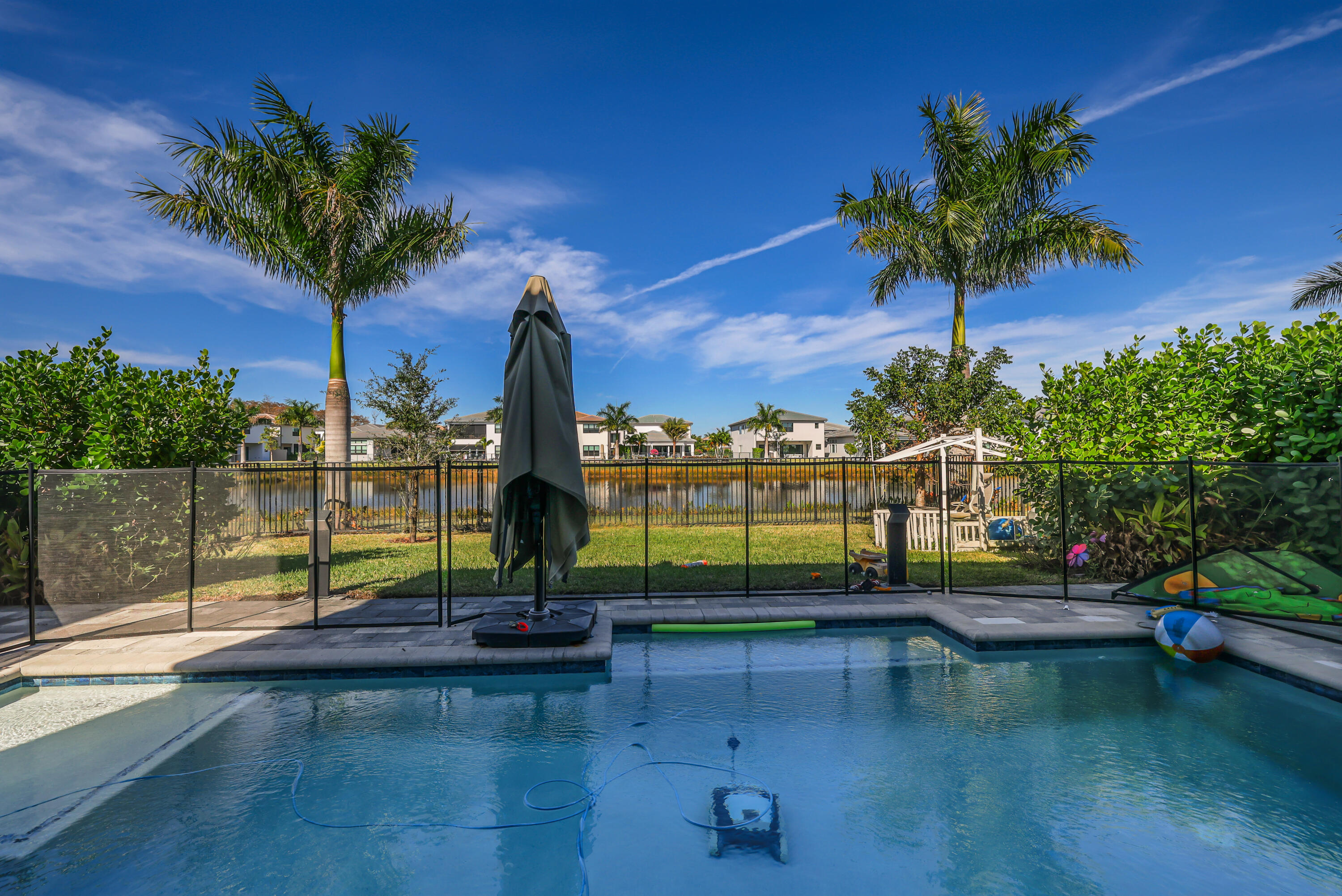 8593 Swinley Frst Way Boca Raton, FL 33434 - Photo 2 of 35 a view of a lake with a house