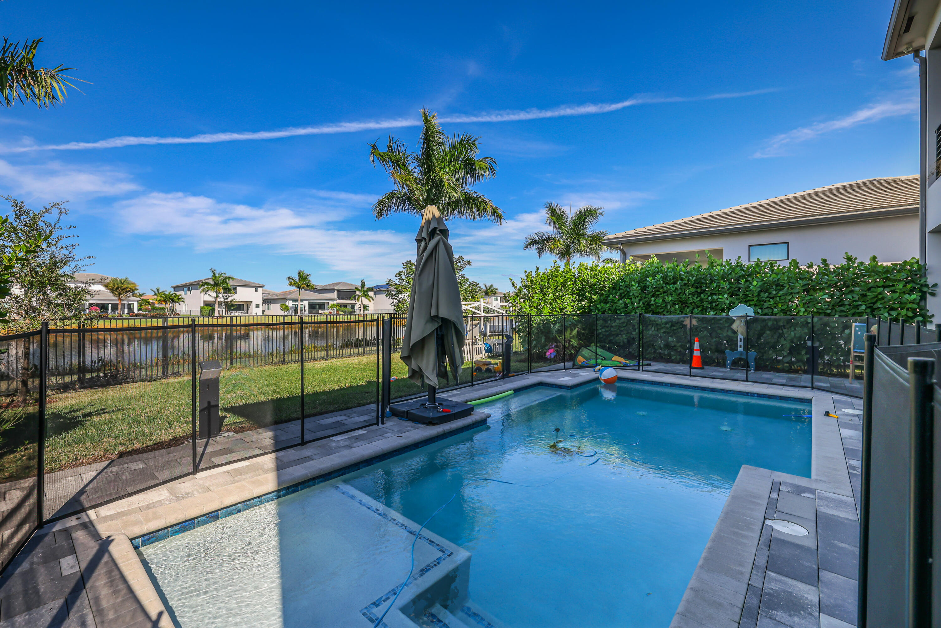 8593 Swinley Frst Way Boca Raton, FL 33434 - Photo 3 of 35 a view of a swimming pool with a patio