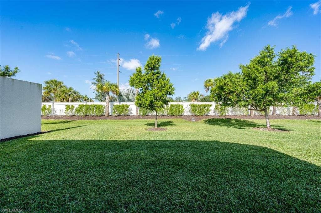 14756 Kingfisher Loop Naples, FL 34120 - Photo 15 of 16 a view of green field