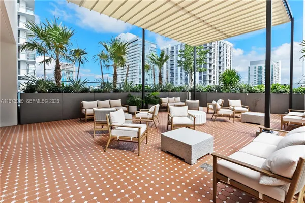 a outdoor space with patio the couches and a dining table with garden view