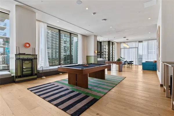 a lobby with furniture and wooden floor