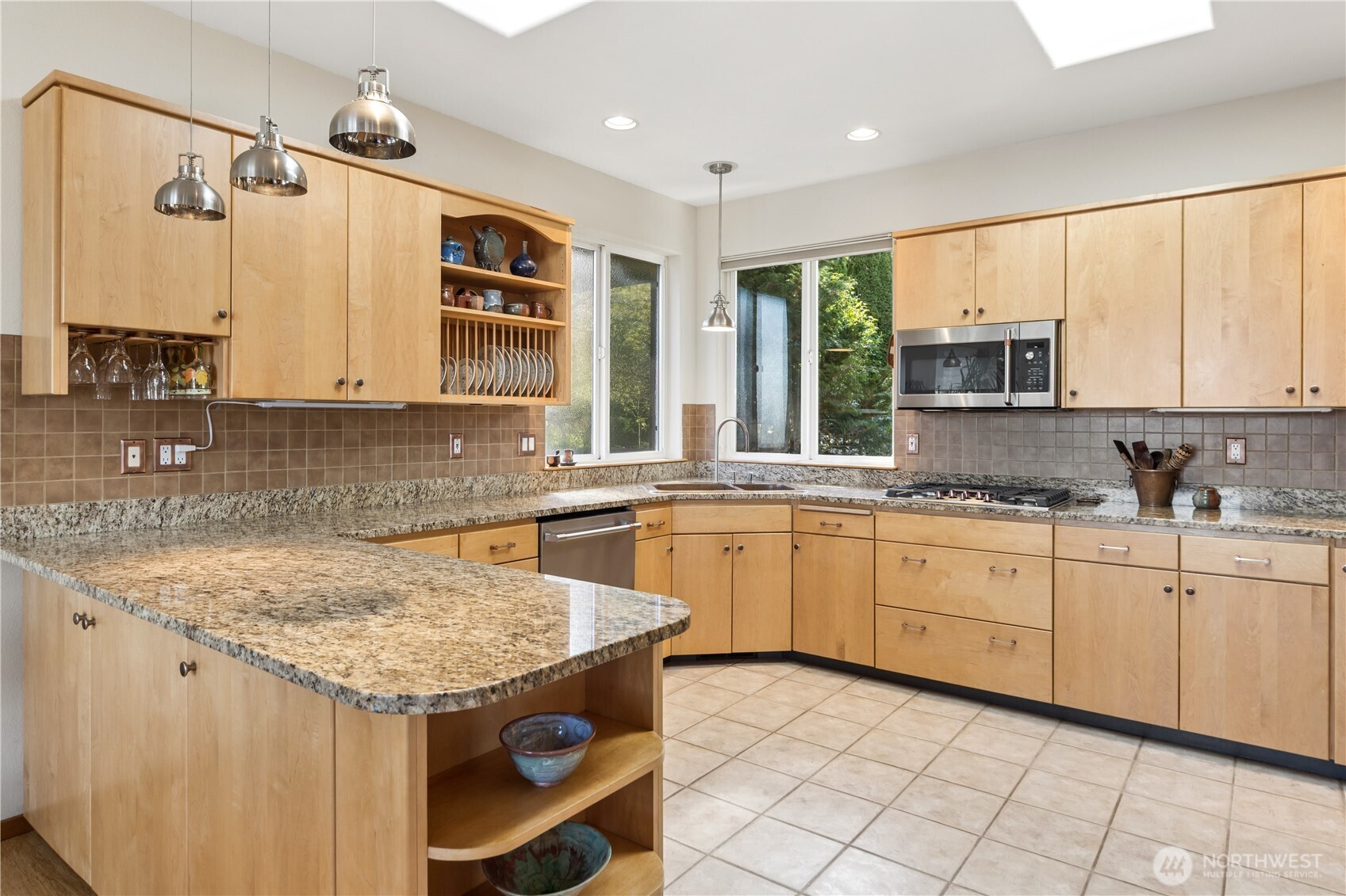 1355 Jackman Street Port Townsend, WA 98368 - Photo 11 of 38 a kitchen with granite countertop a sink window and cabinets