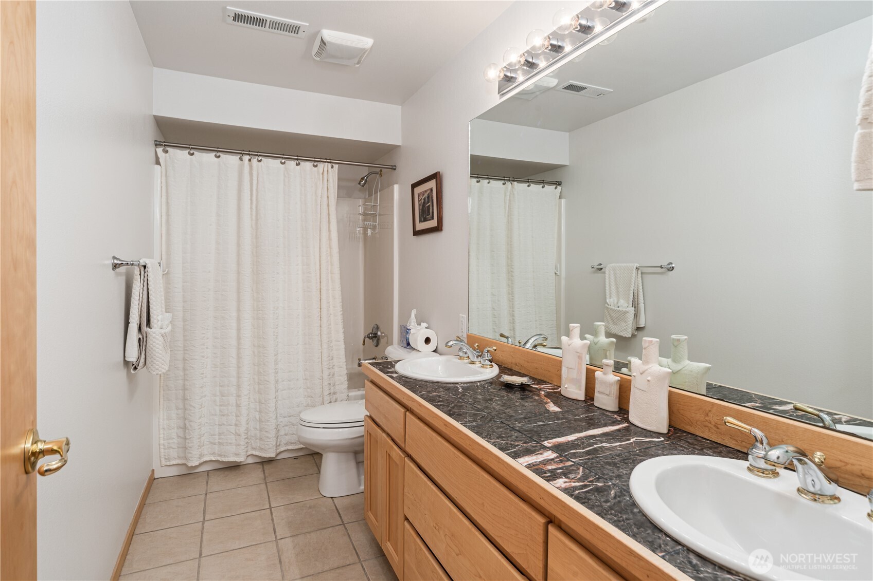 1355 Jackman Street Port Townsend, WA 98368 - Photo 20 of 38 a bathroom with a sink double vanity granite toilet and a mirror