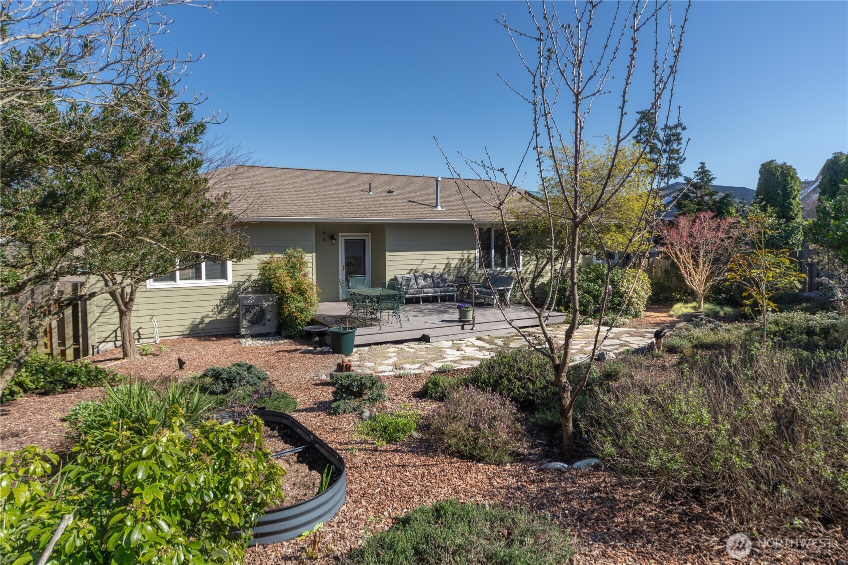 1355 Jackman Street Port Townsend, WA 98368 - Photo 34 of 38 a view of patio with table and chairs under an umbrella