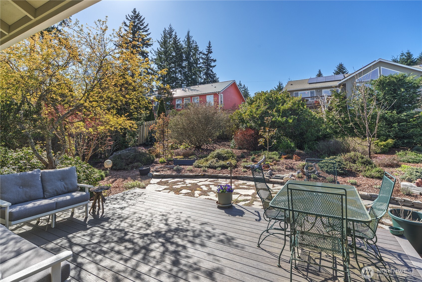 1355 Jackman Street Port Townsend, WA 98368 - Photo 36 of 38 a view of a chairs and table in the backyard