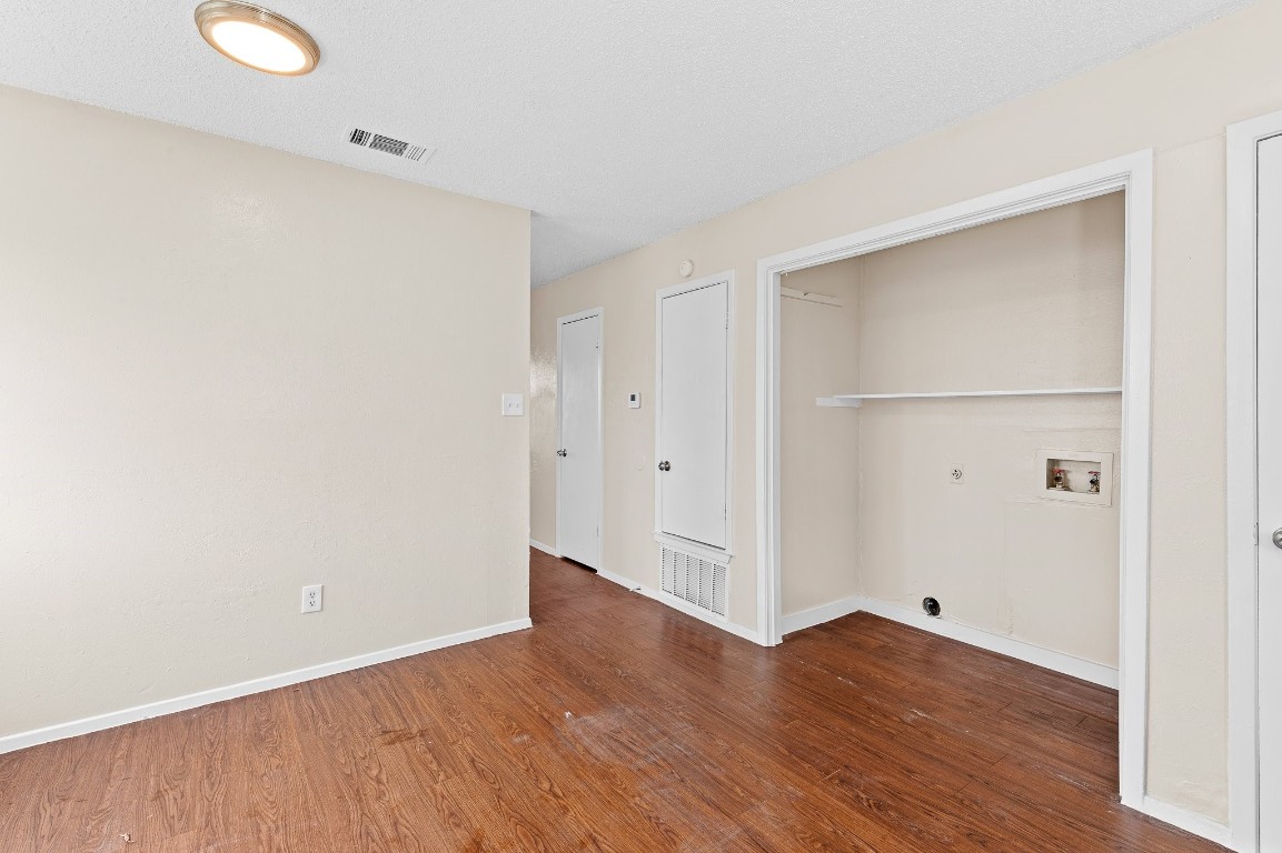 8412 Garcreek Circle, Unit D Austin, TX 78724 - Photo 14 of 23 a view of an empty room with wooden floor