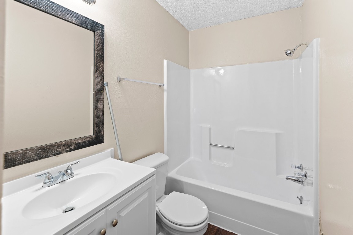 8412 Garcreek Circle, Unit D Austin, TX 78724 - Photo 20 of 23 a bathroom with a sink a toilet and shower