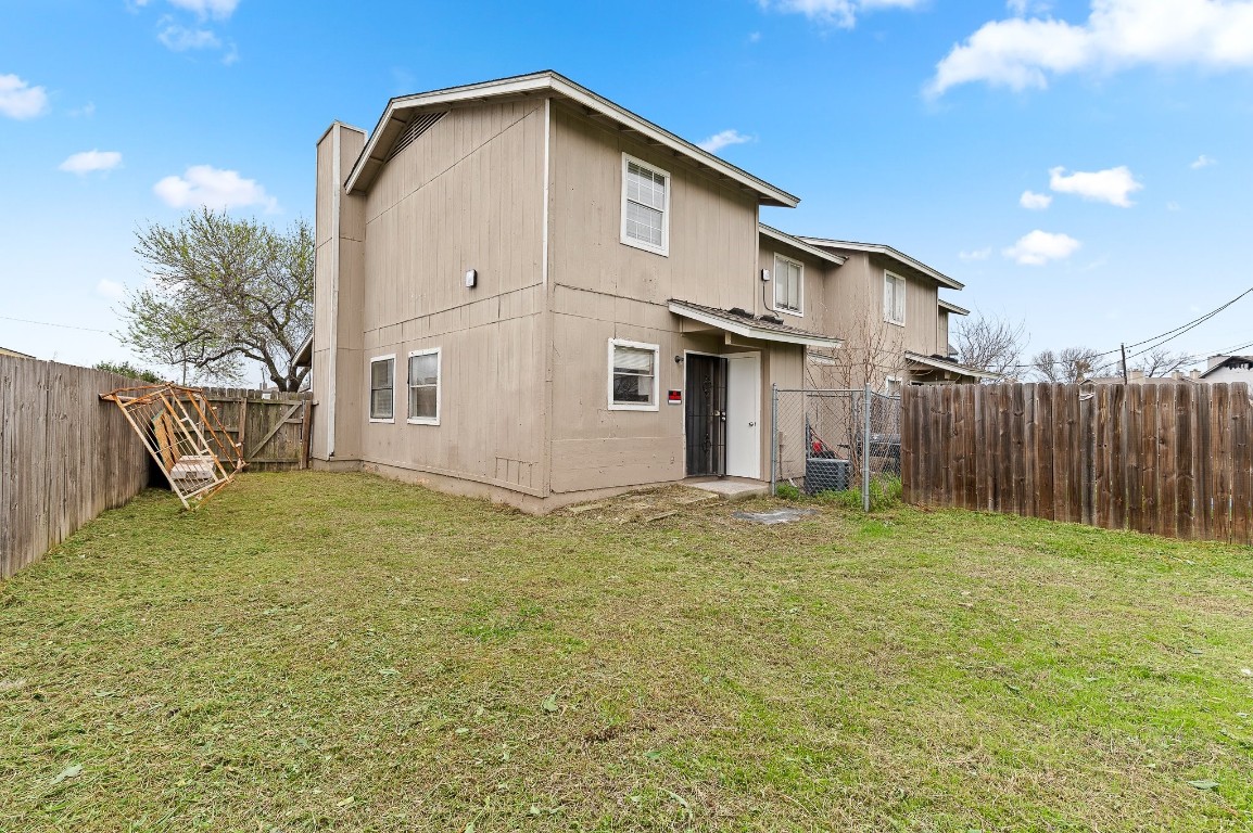 8412 Garcreek Circle, Unit D Austin, TX 78724 - Photo 22 of 23 a view of a backyard with wooden fence