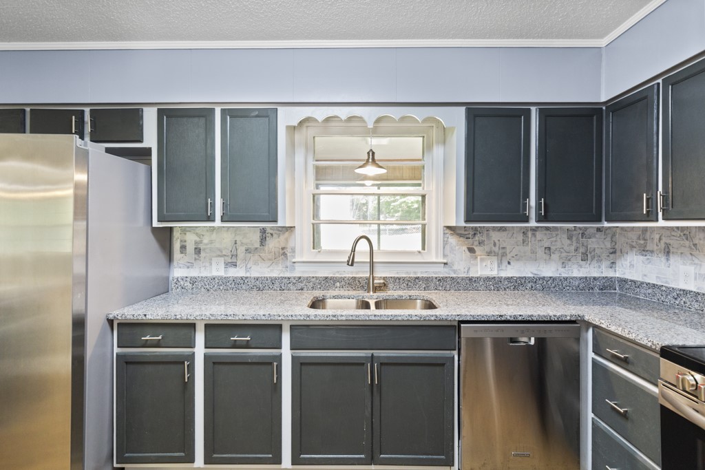 104 Doyle Drive Seneca, SC 29678 - Photo 3 of 19 This modern kitchen offers ample counter space and sleek stainless steel appliances.