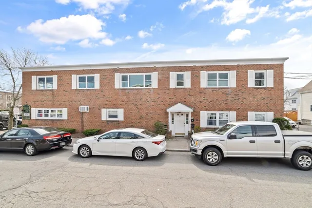 a view of a car parked in front of a building