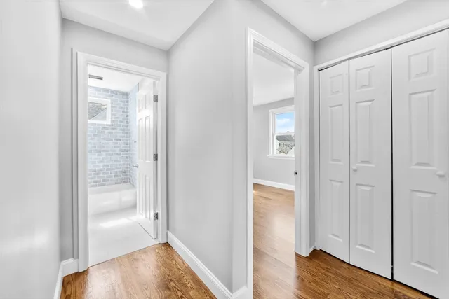 a view of a bathroom with wooden floor
