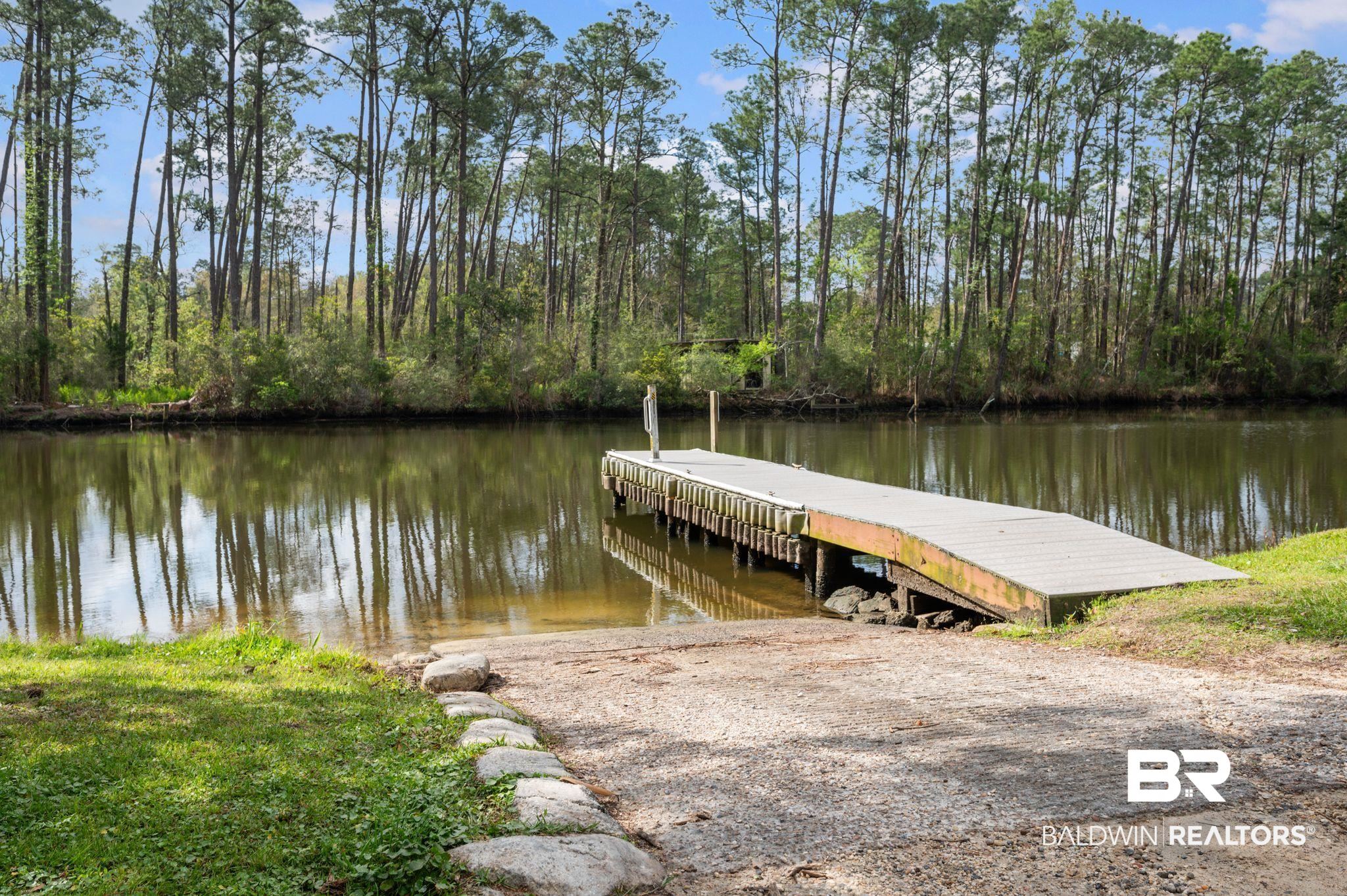 24711 County Road 20, Unit A11 Elberta, AL 36530 - Photo 31 of 35 Dock area with a water view and a boat ramp