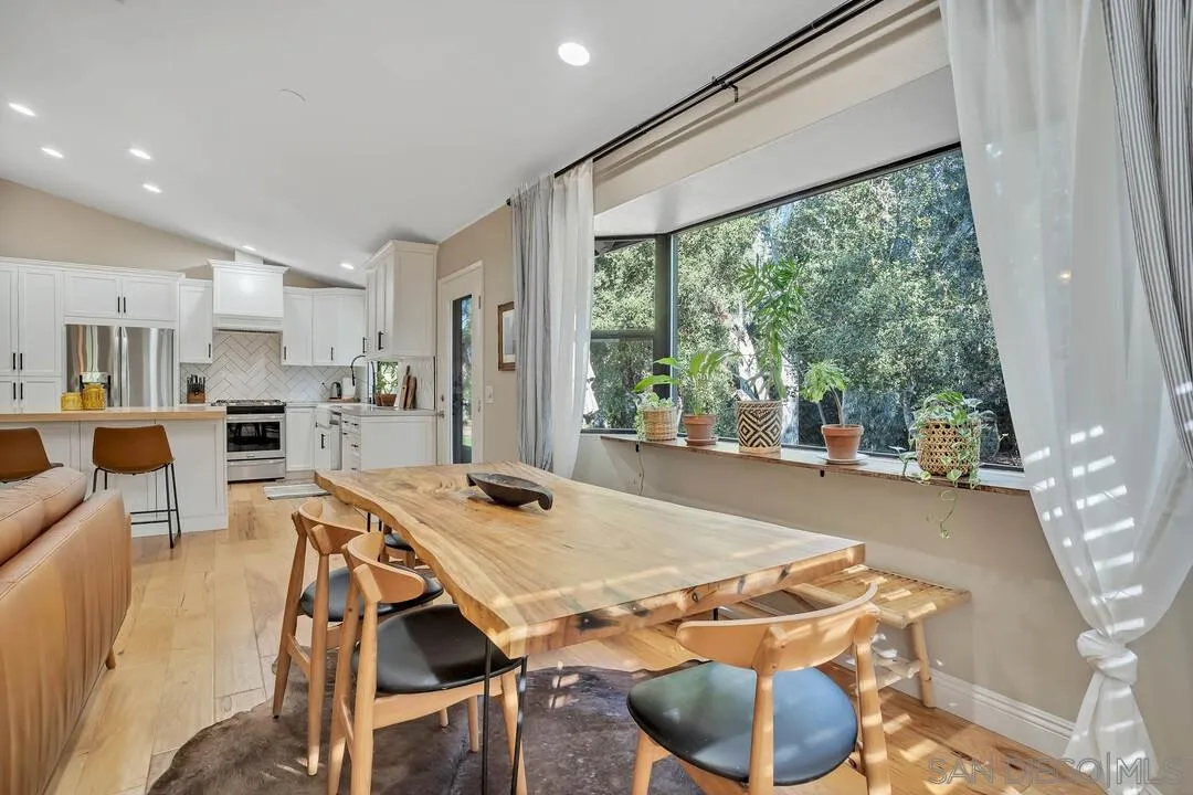 15867 Prairie Vista Road Poway, CA 92064 - Photo 22 of 70 a dining room with furniture and a floor to ceiling window