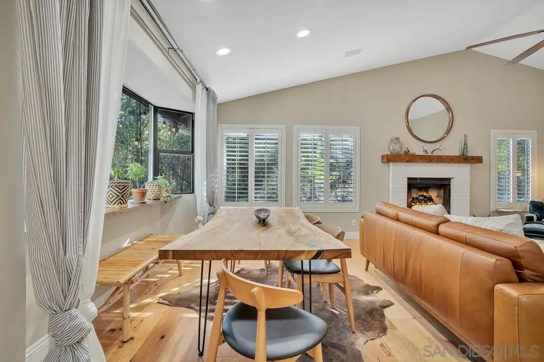 15867 Prairie Vista Road Poway, CA 92064 - Photo 23 of 70 a living room with furniture a window and a fireplace