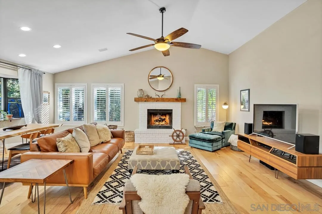 15867 Prairie Vista Road Poway, CA 92064 - Photo 24 of 70 a living room with furniture a fireplace and a large window