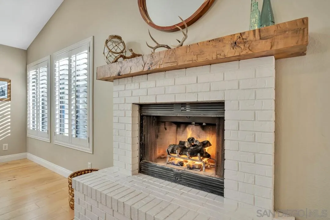 15867 Prairie Vista Road Poway, CA 92064 - Photo 29 of 70 a bedroom with a fireplace a bed and a fireplace