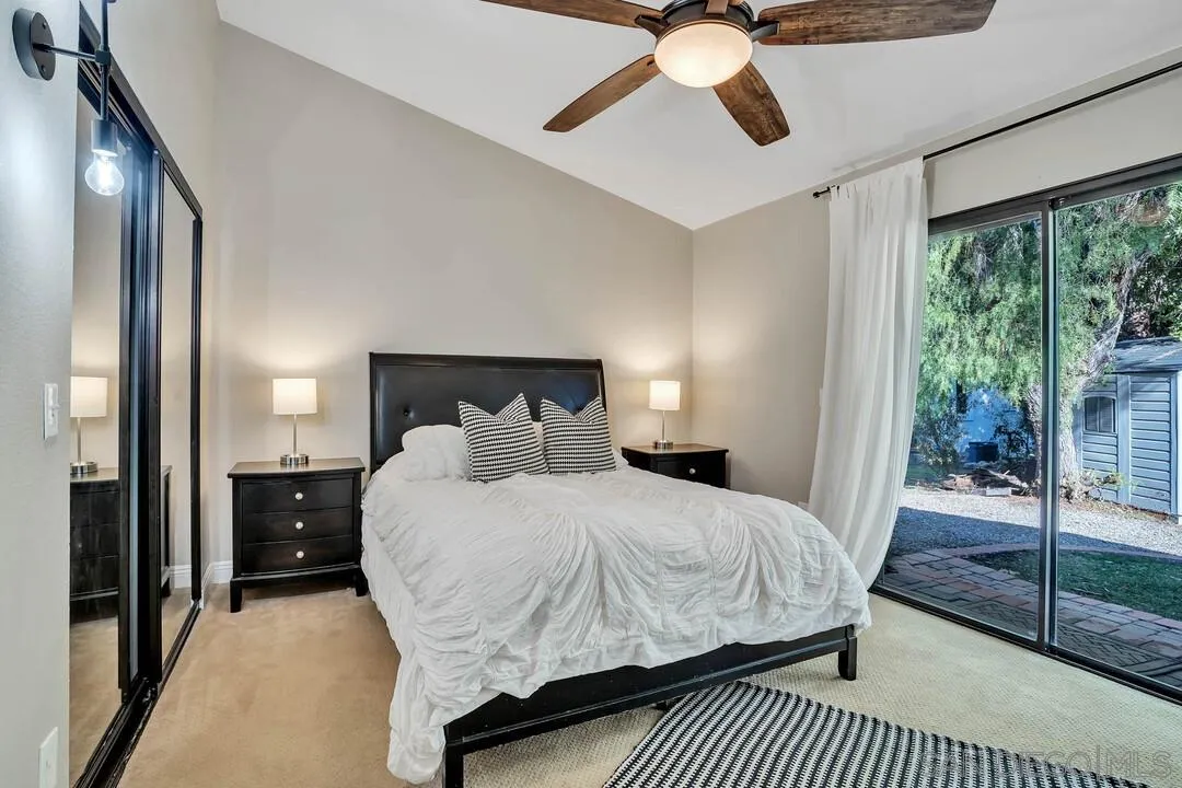 15867 Prairie Vista Road Poway, CA 92064 - Photo 31 of 70 a bedroom with a bed and large mirror