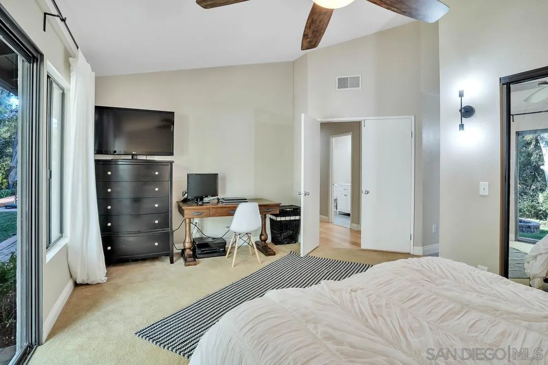 15867 Prairie Vista Road Poway, CA 92064 - Photo 33 of 70 a bedroom with a bed and a television