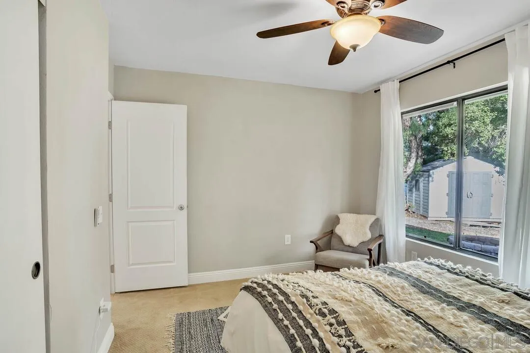 15867 Prairie Vista Road Poway, CA 92064 - Photo 43 of 70 a bedroom with a bed and wooden floor