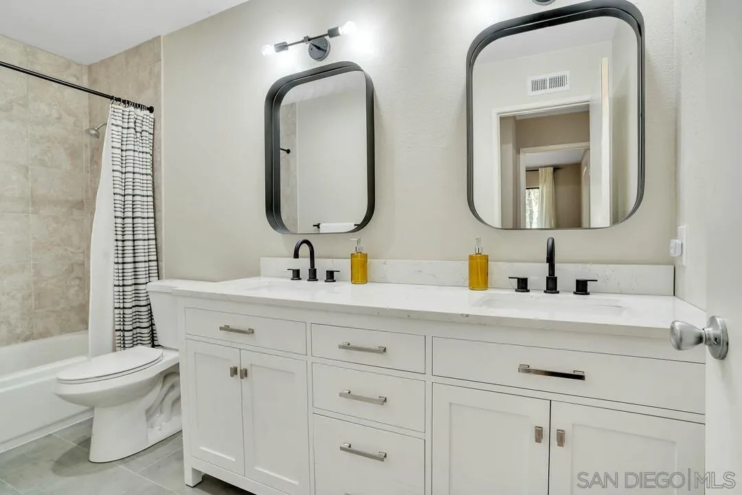 15867 Prairie Vista Road Poway, CA 92064 - Photo 44 of 70 a bathroom with 2 sink toilet and a mirror