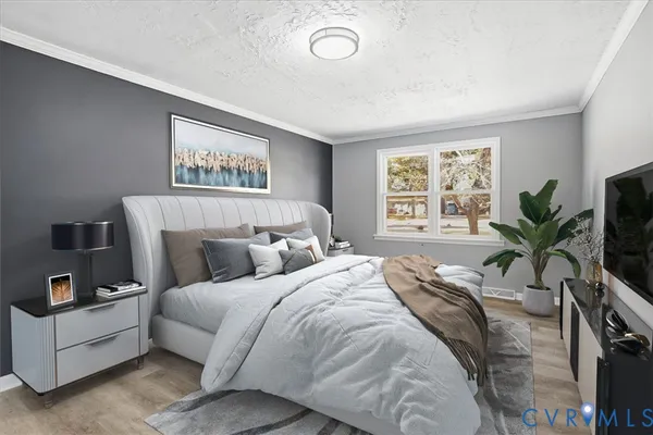 a bedroom with a large bed and a window