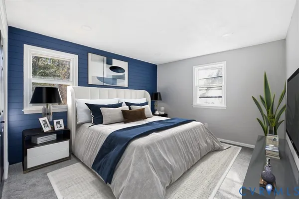 a bathroom with a granite countertop sink a toilet a mirror and shower
