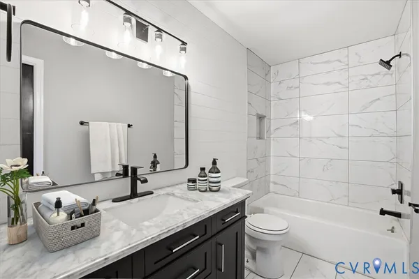 a kitchen with stainless steel appliances a refrigerator sink and cabinets