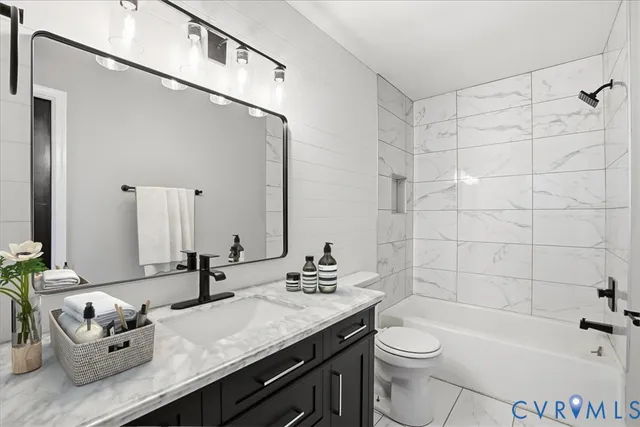 a kitchen with stainless steel appliances a refrigerator sink and cabinets