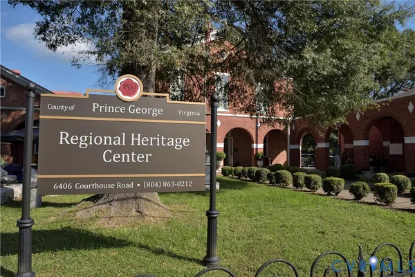 a sign that is on a pole on the street