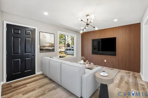 a kitchen with stainless steel appliances white cabinets a sink a stove a refrigerator and white cabinets