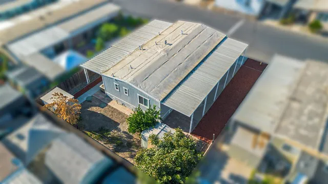 a view of an chairs and table in the patio