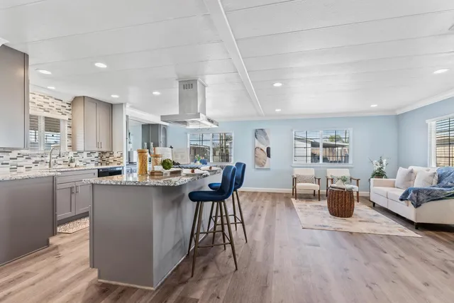 a kitchen with counter space and wooden floor