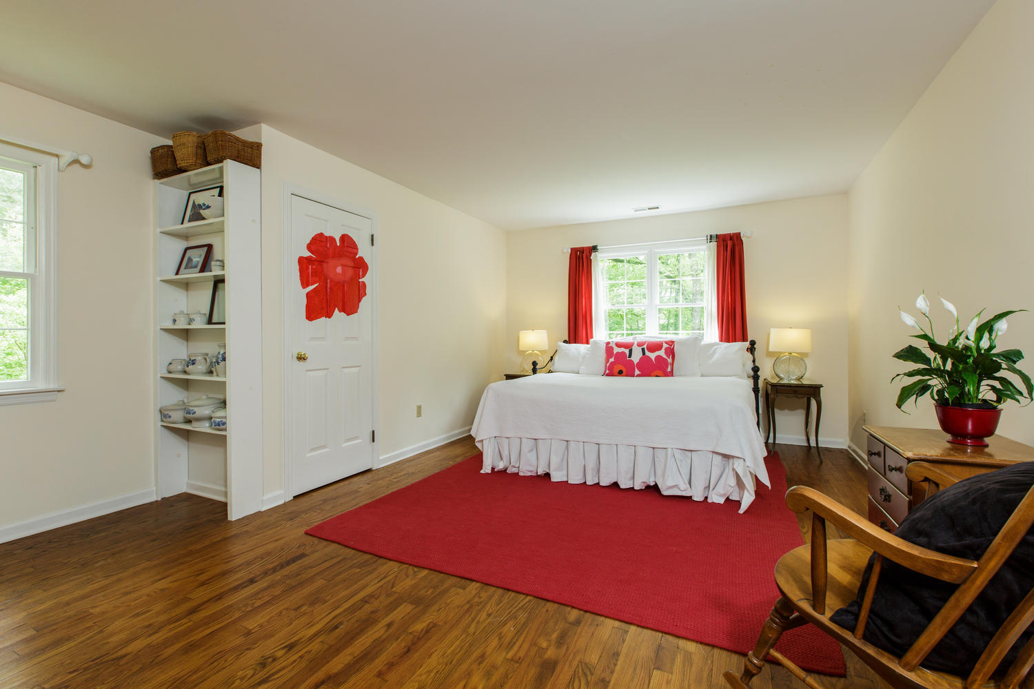 135 Mill Road New Canaan, CT 06840 - Photo 11 of 16 a bedroom with a bed and a dresser next to a window