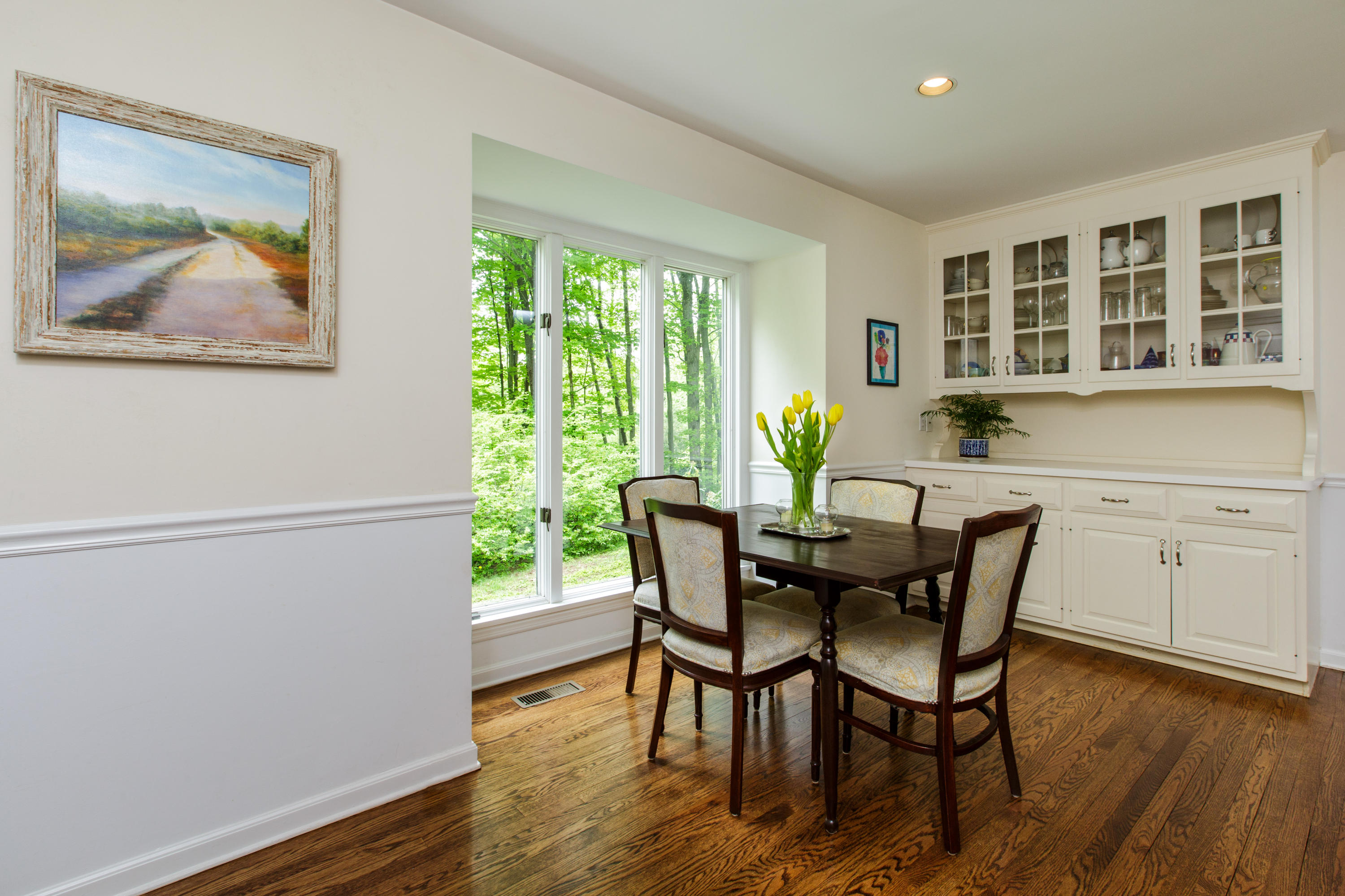 135 Mill Road New Canaan, CT 06840 - Photo 5 of 16 a view of a dining room with furniture window and wooden floor