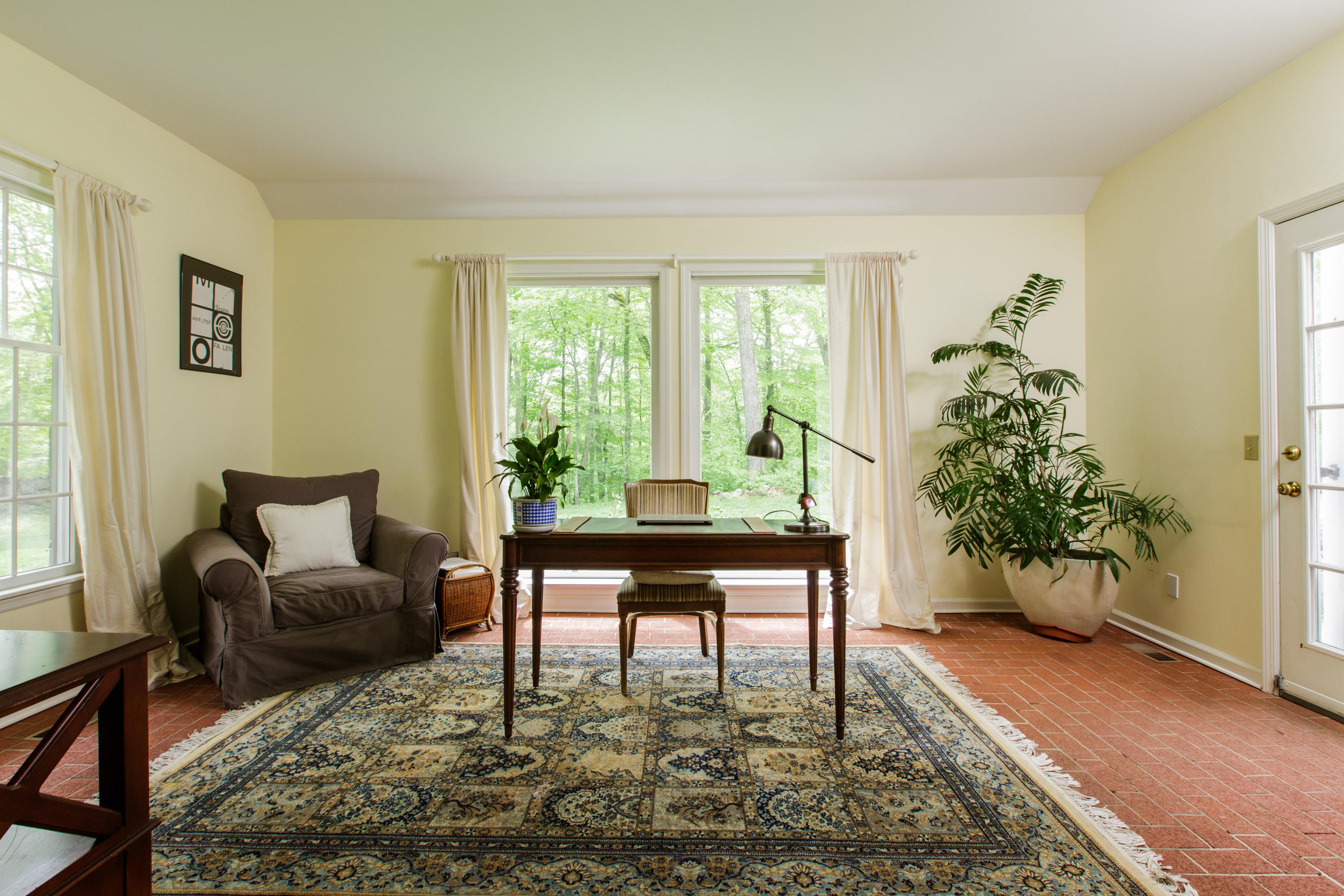 135 Mill Road New Canaan, CT 06840 - Photo 8 of 16 a living room with furniture and a potted plant