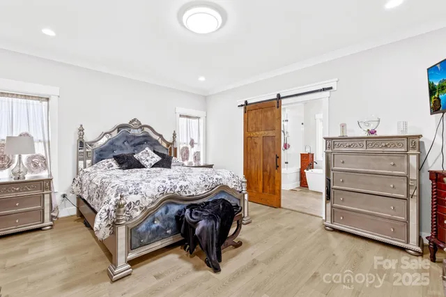 a living room with a couch and a potted plant