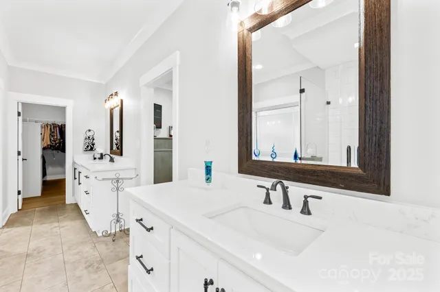 a kitchen with kitchen island granite countertop a table chairs microwave and cabinets