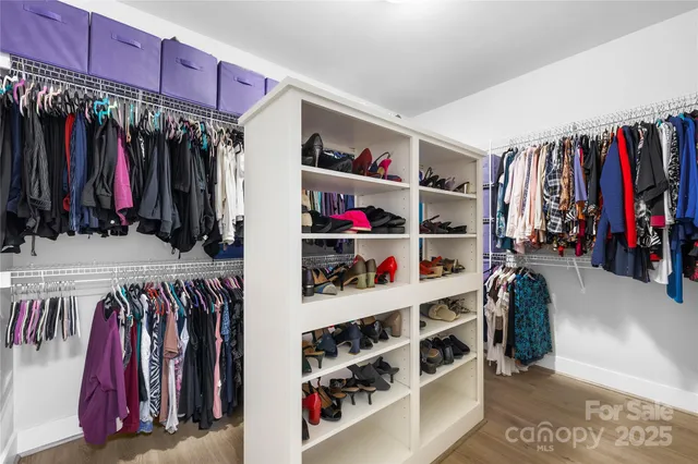a large kitchen with stainless steel appliances lots of counter space and a sink