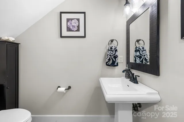 a living room with fireplace furniture and a wooden floor