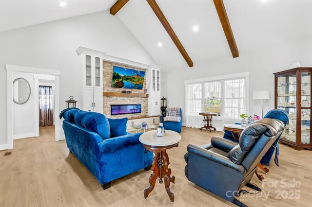 a bathroom with a double vanity sink a mirror and a bathtub