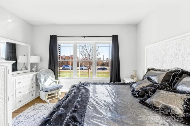 a living room with furniture a couch and a window