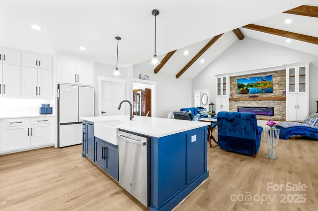 a large kitchen with stainless steel appliances lots of counter space sink and cabinets