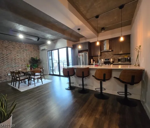 a living room with furniture a flat screen tv and a table