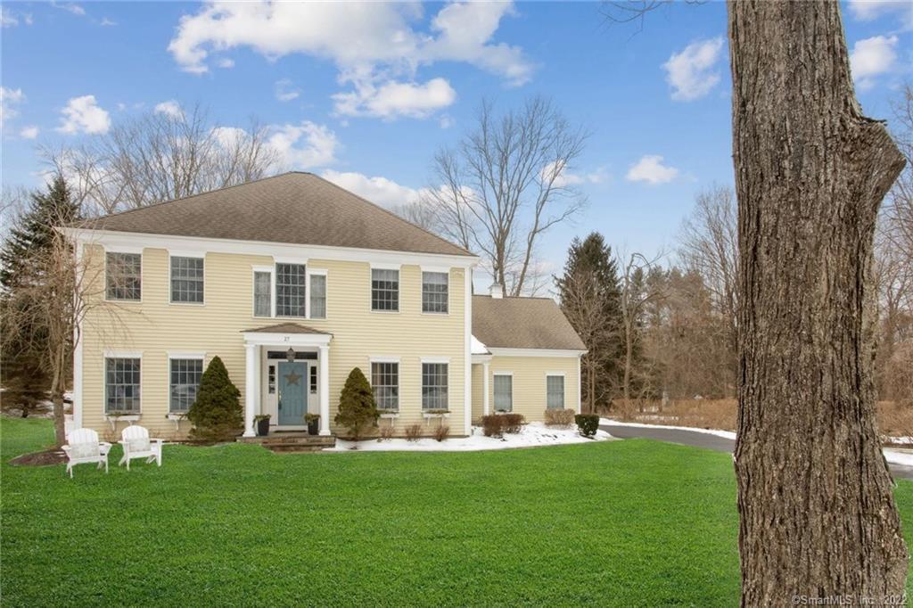 27 Arrowhead Place Ridgefield, CT 06877 - Photo 1 of 1 a view of a white house with a big yard and large trees