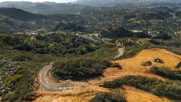 a view of a city with mountain