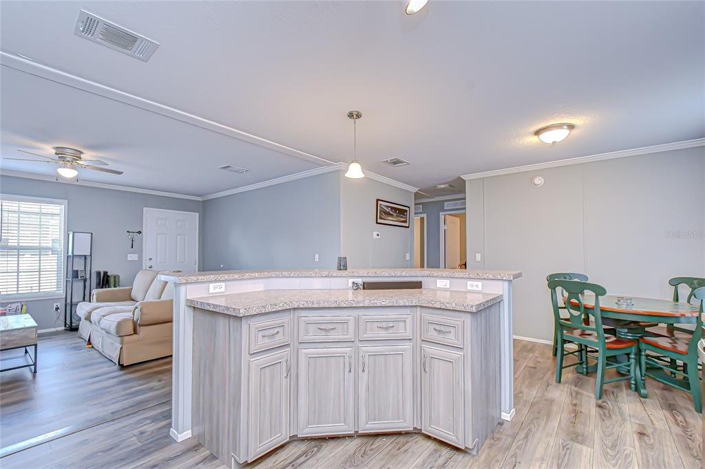 37749 Geiger Road Zephyrhills, FL 33542 - Photo 14 of 36 a kitchen with a table and chairs in it